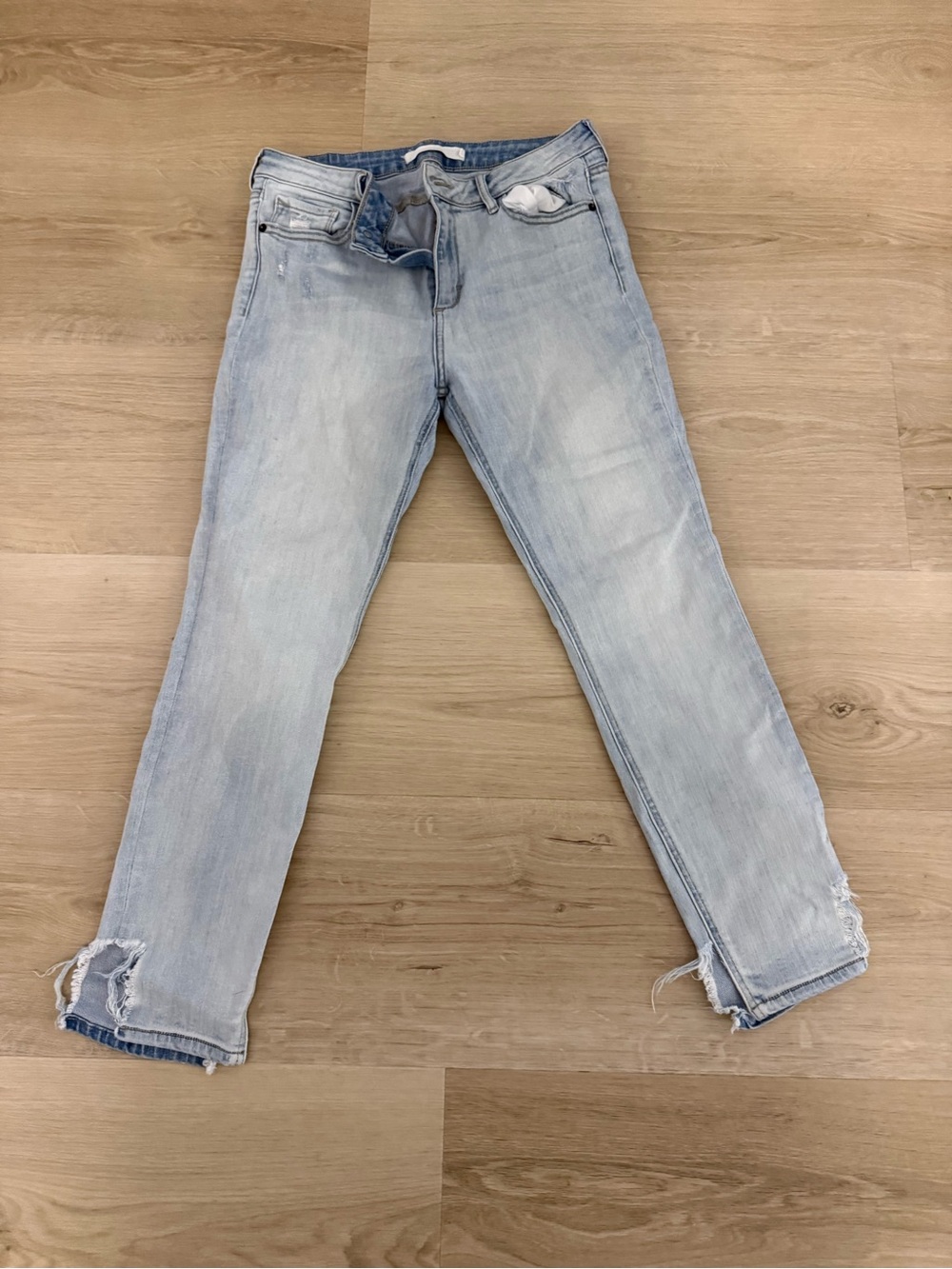 Women's Light Blue Skinny Jeans with Distressed Hem